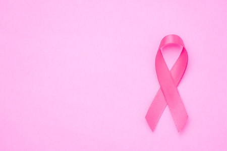 breast cancer awareness ribbon on pink backgroundの写真素材