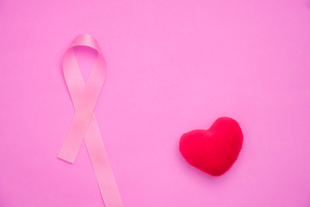 breast cancer awareness ribbon on pink backgroundの写真素材
