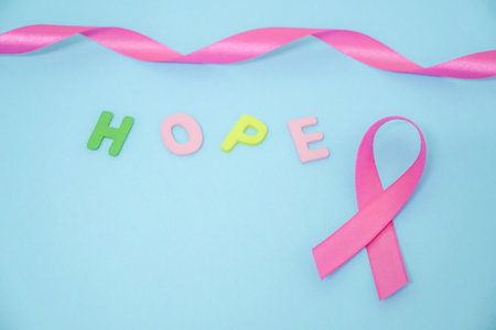 October Breast Cancer Awareness. Pink Ribbon on green backgroundの写真素材