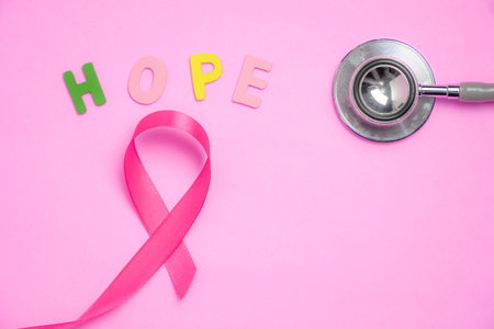 breast cancer awareness ribbon on pink backgroundの写真素材