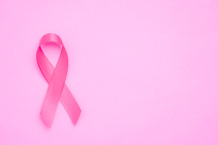 breast cancer awareness ribbon on pink backgroundの写真素材