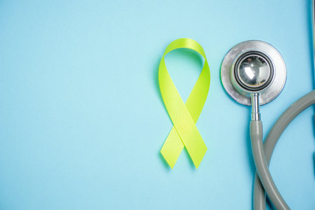 Cancer awareness ribbon on blue backgoundの写真素材