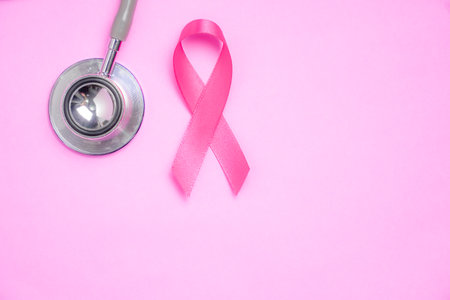 breast cancer awareness ribbon on pink backgroundの写真素材