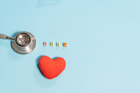 Stethoscope and red heart on blue background. Health care concept.の写真素材