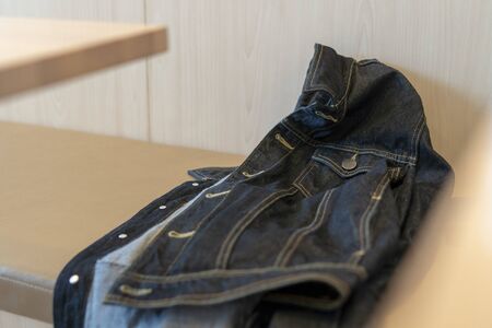 Jeans jacket Men were forgotten in the restaurant.の写真素材