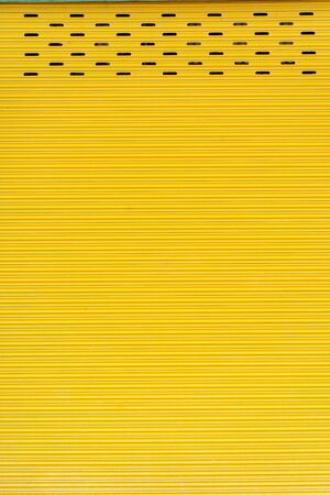 Yellow steel door, beautiful proportions. Can be used as a design background.の写真素材