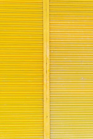 Yellow steel door, beautiful proportions. Can be used as a design background.の写真素材