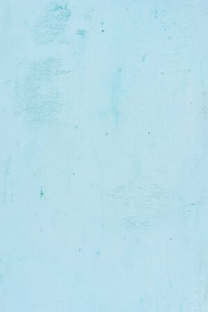 The background of the pastel-blue plaster is striking, beautiful and simple.の写真素材