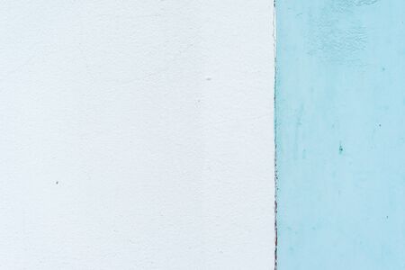 The background of the pastel-blue plaster is striking, beautiful and simple.の写真素材