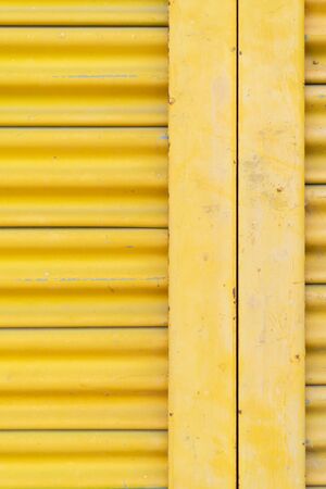 Yellow steel door, beautiful proportions. Can be used as a design background.の写真素材