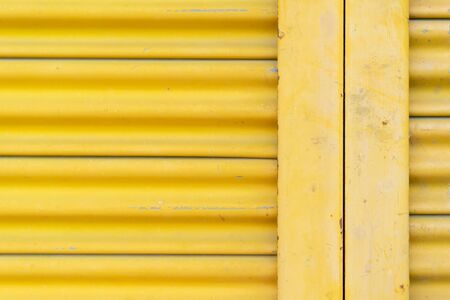 Yellow steel door, beautiful proportions. Can be used as a design background.の写真素材