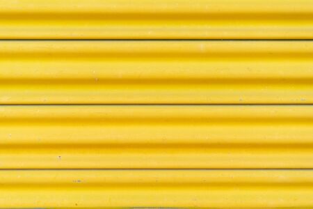 Yellow steel door, beautiful proportions. Can be used as a design background.の写真素材