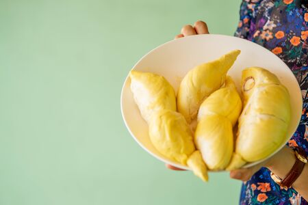 Beautiful yellow durian, ready to eat in the hands of consumers.の写真素材