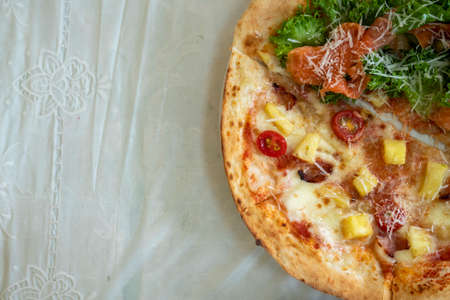 Pizza in front of Salmon Hawaiian's hand-made shop.の写真素材