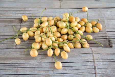 Mafai or Baccaurea ramiflora isolated on bamboo background.の写真素材