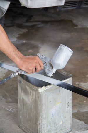 spray gun with paint for painting a steelの写真素材