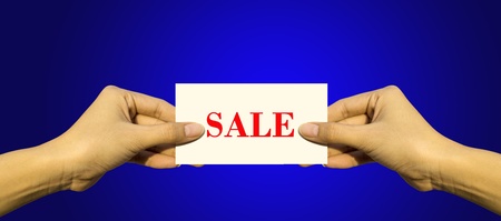 Hand of women holding blank paper label or tag の写真素材