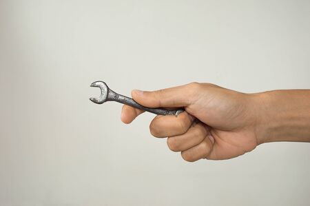 Hand of serviceman with a spannerの写真素材