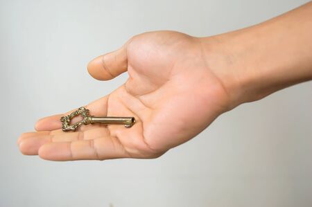 A key in a hand