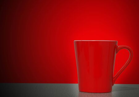 Red cup on wooden table red backgroundの写真素材