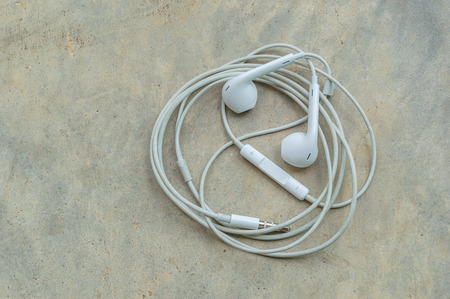 Headphones on cement backgroundの写真素材