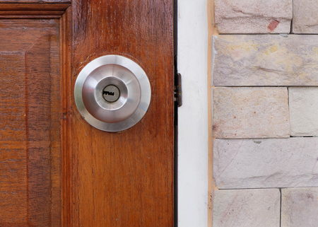 Stainless steel door knob and a key hole.の写真素材