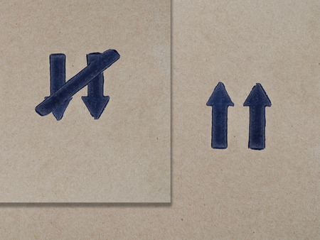 The black arrow on the cardboard.の写真素材