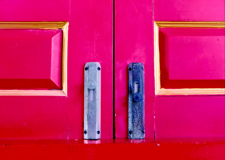 Red latch on the windowの写真素材