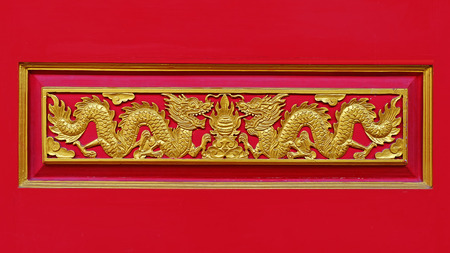 Wood carved golden dragon.の写真素材