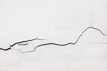 clacked cement of white wall