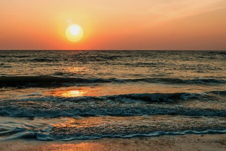 Orange sunset over the seaの写真素材