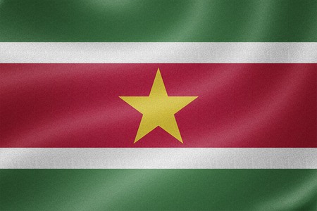 Suriname flag on the fabric texture backgroundの写真素材