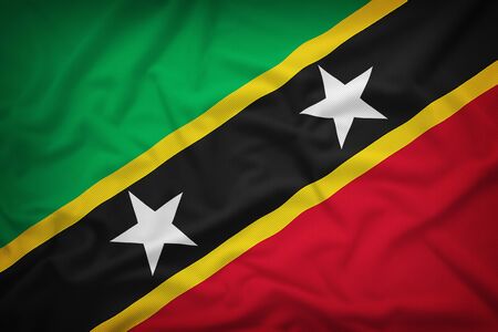 Saint Kitts and Nevis flag on the fabric texture background,Vintage styleの写真素材