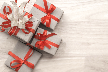 Gifts for special moments flat lay with copy space on wooden backgroundの写真素材