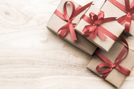 Gifts for special moments flat lay with copy space on wooden backgroundの写真素材