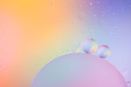 macro of oil mixed with water on colorful backgroundの写真素材