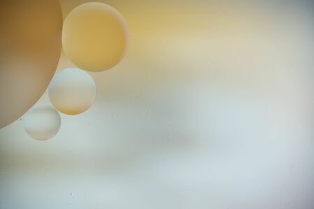 macro of oil mixed with water on colorful backgroundの写真素材