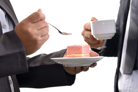 Business people having cake and coffee