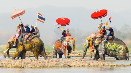 Sukhothai, Thailand, April 7,2016 : Songkran Festival and Had Siew Elephant ordains at Sri Satchanalai riding on elephant by sitting on the back of an elephant crossing a river in the province.のeditorial素材