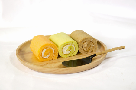 Roll Cake with on Wooden Plateの写真素材