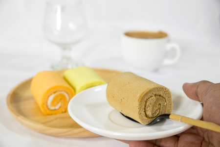Roll Cake with on Wooden Plateの写真素材