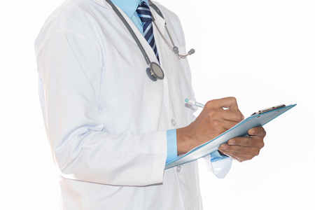 Close up of patient and doctor taking notes. Man doctor concept in hospital.の写真素材