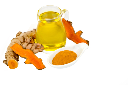 Turmeric Essential Oil ,turmeric roots and powderの写真素材