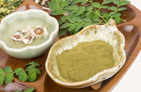 Moringa leaf and seed grinded on white backgroundの写真素材