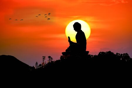 Silhouette of Tian Tan Buddha or Giant Buddha statue at Po Lin Monastery Ngong Ping, Lantau Island, Hong Kong, Chinaの写真素材