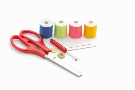 Multi-colored thread,Scissors, sewing needle, tape measure,thread picker clothing repair conceptの写真素材