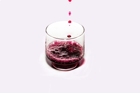 Red wine and Bottle of wine on a white background の写真素材