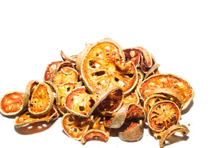 Dried bale fruit, thai herb Isolated on whiteの写真素材