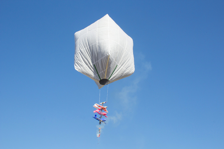 hot air balloon isolated on skyの写真素材