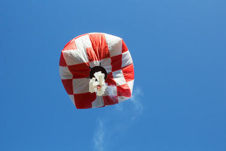 hot air balloon isolated on skyの写真素材